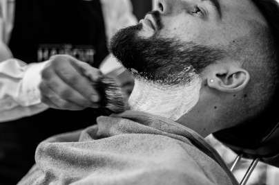 man shaving at barber